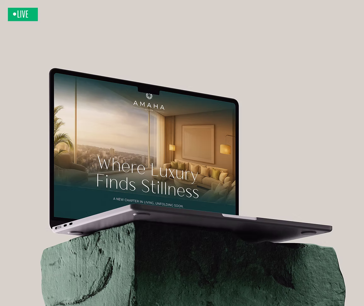 Amaha Estates website on a laptop